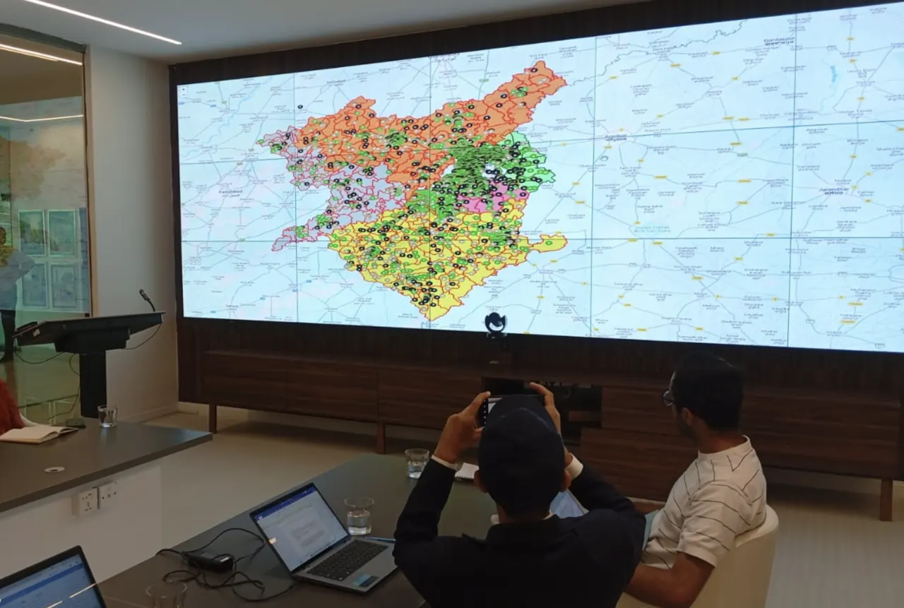 Participants viewing a regional monitoring map on a large display.